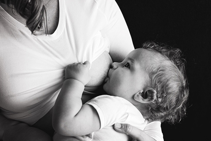 Woman Breastfeeding Baby reduces breast cancer risk